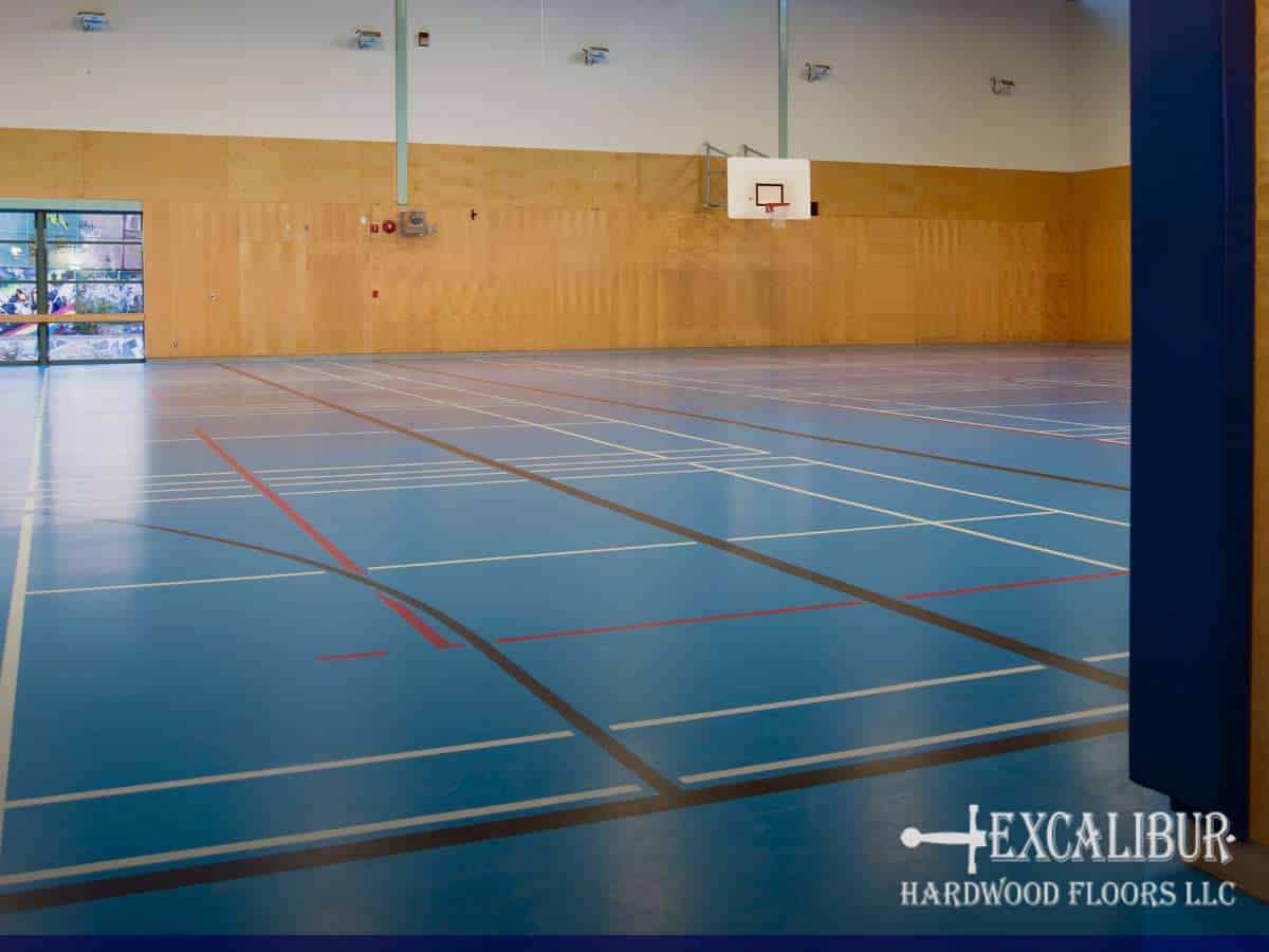 Indoor court with gym floor slippery issue, marked with various game lines