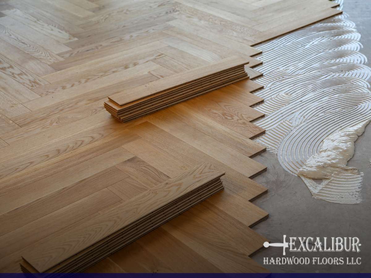 Installation process showing a Hardwood Gym Floor over a concrete floor with adhesive applied